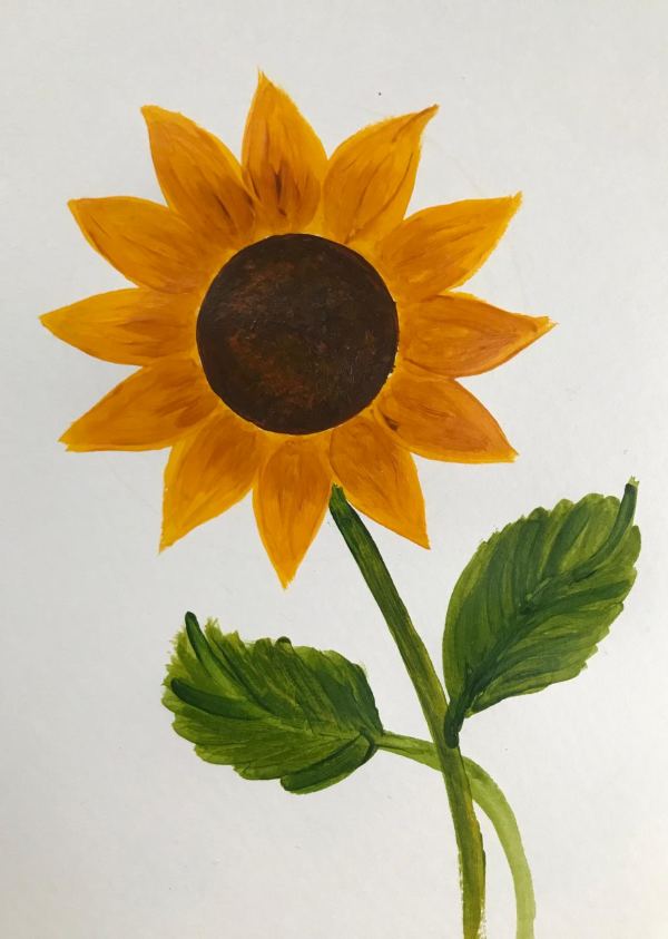 Leuchtende Sonnenblume mit grünen Blättern
